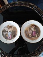 Both plates showing front designs, size reference