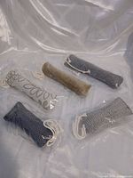 Five catnip stick toys in plastic bags displayed together