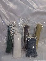 Five sealed catnip toys standing upright showing colours and tassels