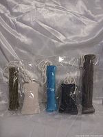 Five sealed fabric catnip toys displayed together