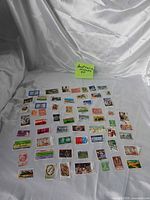 Full layout of 60 Australian stamps on fabric background