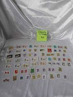 Full group of 70 Canadian stamps with note indicating quantity