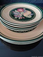 Stack of seven plates showing size contrast and matching design