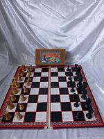 Full view of board set up with all pieces and storage box