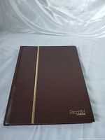 Front cover of brown Prophilid stamp album