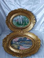 Both needlepoint artworks showing overall design and frames