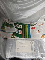 Overall view of unfolded brochure and cards