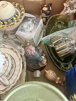 Top view showing mix of china, glassware, figurines and accessories