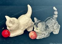 Two Goebel porcelain kitten figurines with red balls