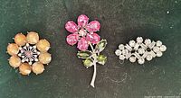 Front view grouping of the three rhinestone brooches