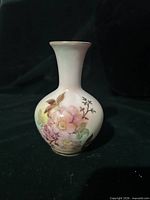 Front view of porcelain bud vase showing Wild Rose floral pattern and gold accents