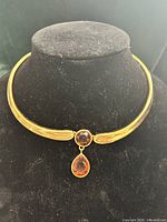 Necklace on display bust showing front view with pendant