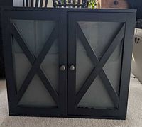 Front view of black cabinet closed