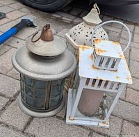 All three lanterns grouped on pavement