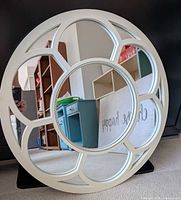 Front view of circular floral mirror