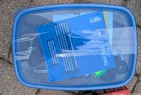 Top view of closed container showing Spalding pump packaging inside