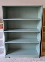 Front view showing full bookshelf and shelves