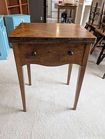 Front view of sewing machine table closed