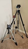 Three tripods standing at different heights