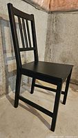 black painted wood chair side view