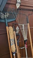Group shot showing all garden tools against garage door