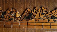 Close-up of wood pieces forming figures in The Last Supper scene