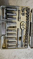 Chrome ratchet and 31 sockets plus extensions in case