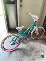 Full side view of teal Schwinn Girl Talk 20-inch bicycle