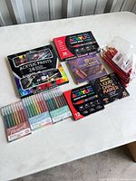 Full lot overview on table showing all boxed and bagged items