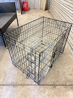 Angled view of wire dog crate showing overall structure