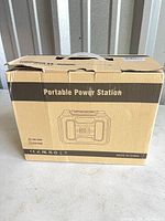 Front of sealed box showing product illustration, rating 100-120V and 220-240V