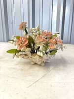 Front view of seashell floral arrangement