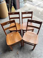 Four children’s chairs front view