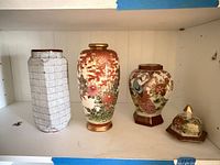 All three porcelain pieces on shelf