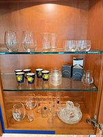Cabinet with all glassware displayed on three shelves