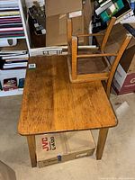 Tabletop showing crack, chair upside down on table