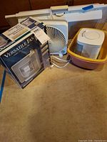 All items grouped: Duracraft boxed fan, square tabletop fan, window fan, heater in basin