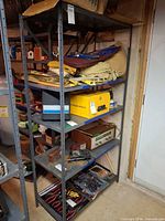 Full view of metal shelving unit with five shelves