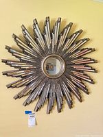 Front view of the starburst wall mirror mounted on wall