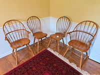 Set of four oak Windsor chairs, two with arms, two without
