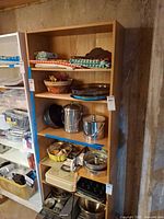 Full view of five-shelf pressed board unit with contents (not included)