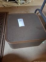 Brown textured zippered carrying case closed