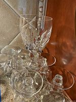 Group of Waterford crystal stemmed glasses showing cut pattern, stem and base