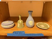 All four Wedgwood jasperware pieces on shelf