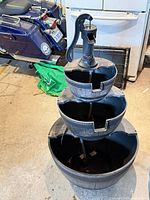 Full view of three-tier faux wood fountain showing stacked bowls and base