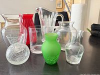 Eight glass pieces grouped on table