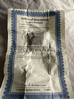 Certificate describing 14kt white gold diamond ring