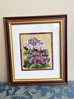 Front view of framed Bunka floral embroidery showing artwork, mats and frame