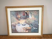 Front view of framed garden table-setting print