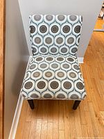 Front view of geometric patterned slipper chair